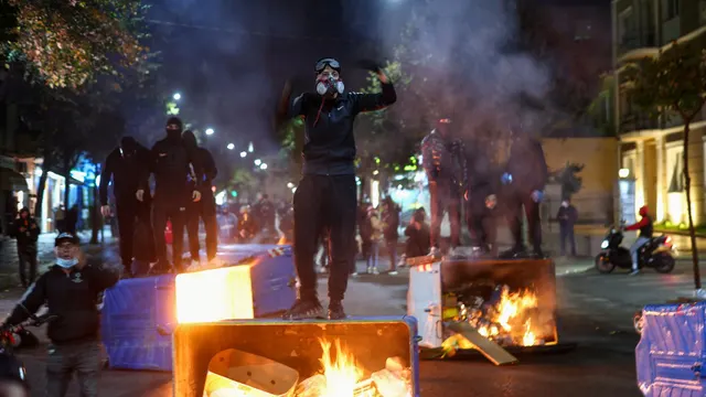 Albanians set fire to government buildings and clash with riot police in latest protests